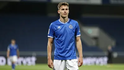A photorealistic image of a 22-year-old anonymous left-back player of Cercle Brugge, wearing a blue jersey and white...