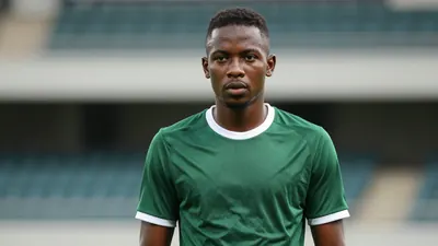 Mid-20s African-descent midfielder, lean build, intense gaze, dark green and white training shirt with plain cotton...