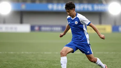 A photorealistic image of an anonymous 18-year-old left-footed winger in a blue and white jersey, with a white shirt and...